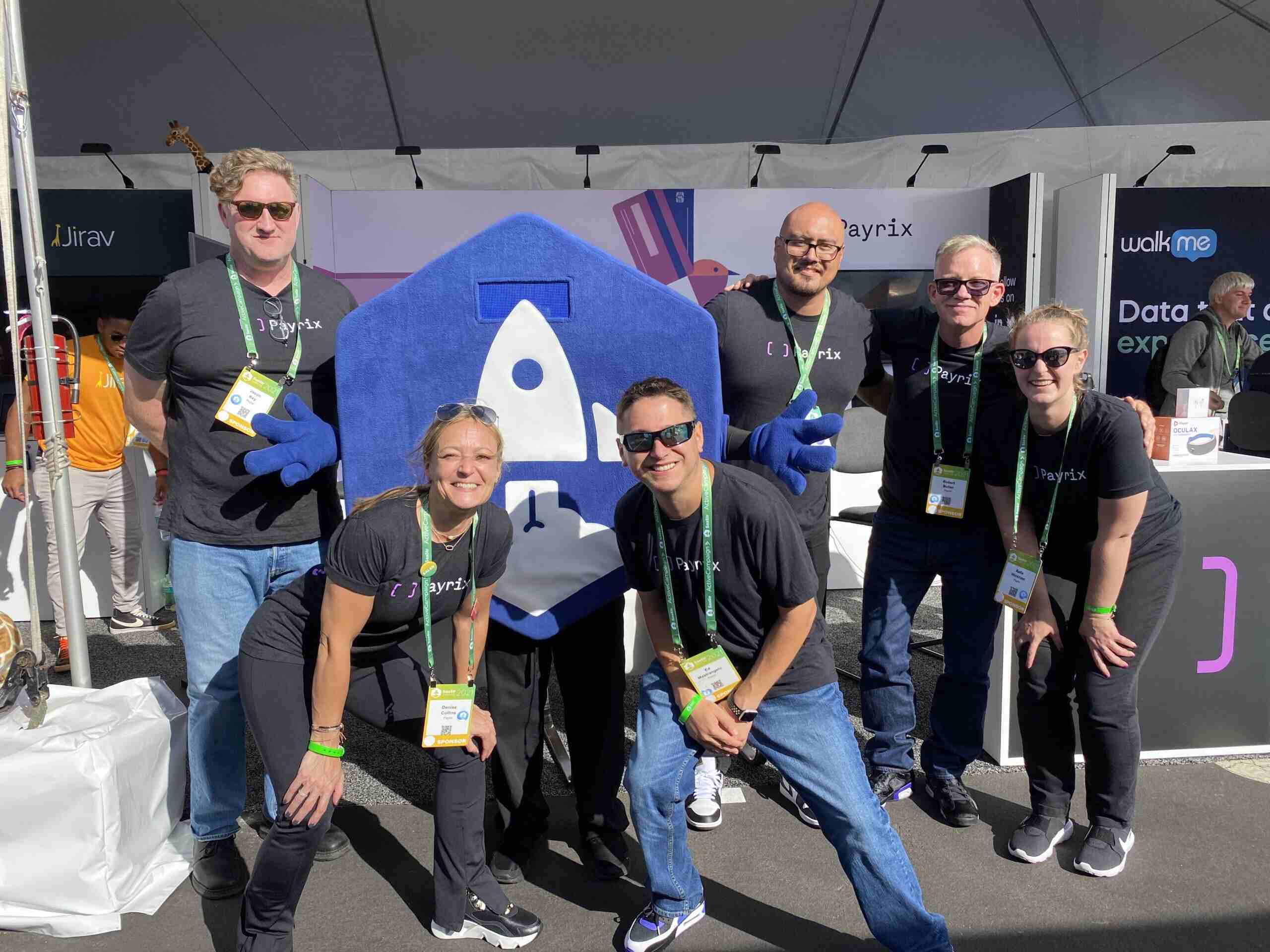 Payrix employees posing for a photo at SaaStr 2021